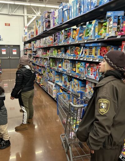 Sheriff's Officers Christmas shopping with children