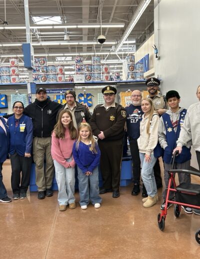 Sheriff's Officers posing for a picture with the public and Walmart employees