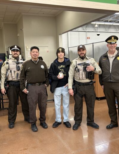 Sheriff's officers participating in Shop with a Sheriff event