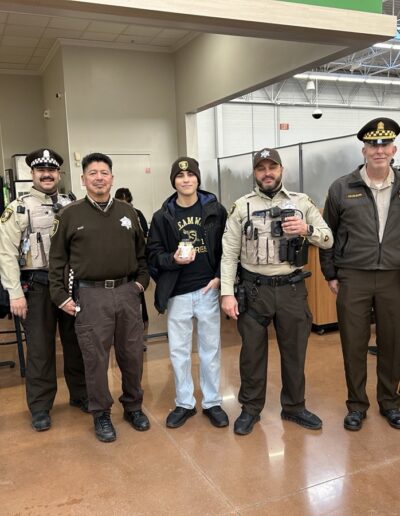 Sheriff's officers participating in Shop with a Sheriff event