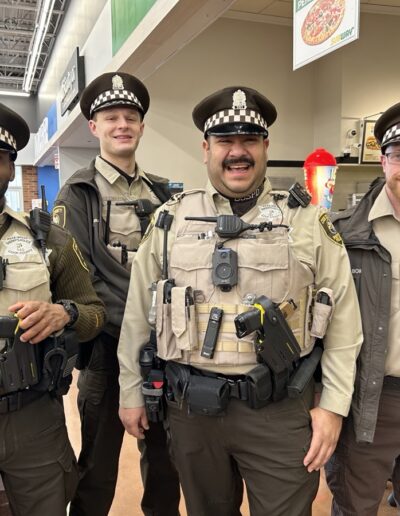 Sheriff's officers participating in Shop with a Sheriff event